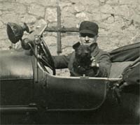 A man, a dog, and a vintage car