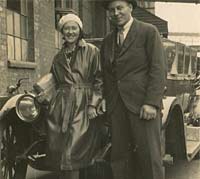 A father and daughter stood near a car