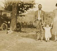 Three people and a Model T Ford