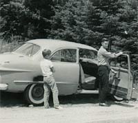 A parked car in the 1950s