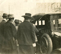 People enter a car in the 1920s
