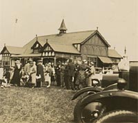 People and cars at a sports day