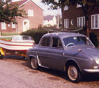 A Dauphine towing a small boat