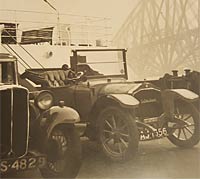 The De Dion Bouton next to the Forth Rail Bridge