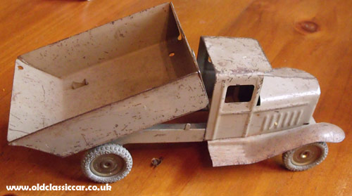 Tipping rear truck body in the raised position