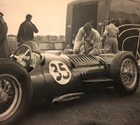 Two BRM V16s and the team transporter