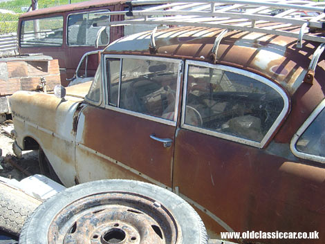 Bleached in the sun but probably not terminally-rusty, a 1950s Opel awaits its future.