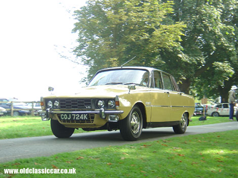 A V8-powered Rover P6 arrives at Cholmondeley Castle.