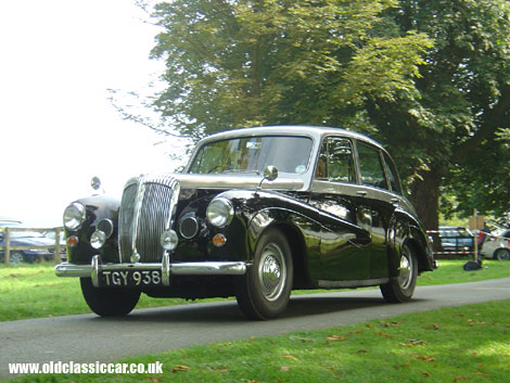 The owners of this 1950s Daimler make a dignified arrival at Cholmondeley.