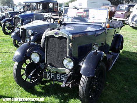 A rare Clyno drophead tourer parks up alongside a mid-30s Austin.