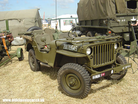 A wartime Jeep takes part in a display of preserved military vehicles.