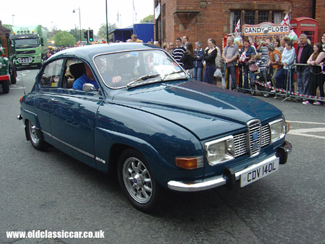 A V4-engined Saab 96 drives through the streets of Sandbach.