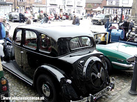 A Rover P3 and a Stag look across at a P4 Rover at this local gathering.