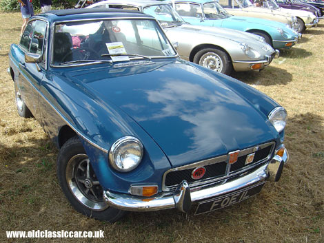 Popular as ever, the MGB GT, alongside a trio of Jaguars and an earlier MGB Roadster.