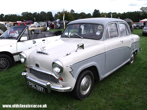 A two-tone Austin Cambridge braves the rain at a show in Cheshire.